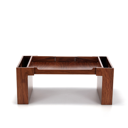 A bedroom that creates a space both lived-in and luxurious, from the tray to the frames, the pen box to the photo cubes. The wood adds a sense of timelessness,